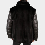 Black puffer jacket with fur trim on a white background
