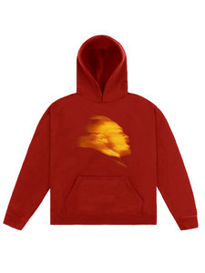 Red fleece hoodie with golden-orange blurred portrait graphic on the chest, kangaroo pocket and ribbed cuffs