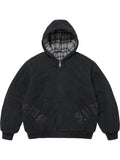 Black washed cotton hooded jacket with plaid-lined hood, dark leather appliqué lettering, front pocket and ribbed cuffs.