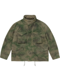 Front view of the green tie-dye M65 field jacket showing the flap pockets and stand collar.