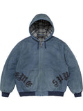 Blue washed cotton hooded jacket shown from the front, featuring plaid lining, zip closure, leather appliqué details and ribbed trim.